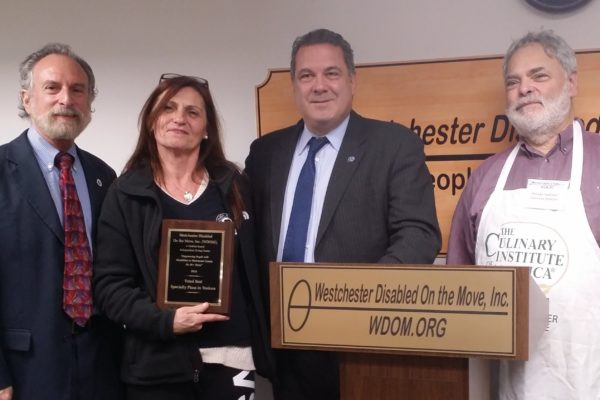 Michael Sabatino, Mayor Mike Spano, and WDOMI Executive Director Mel Tanzman present the awards to Grandma Angelina’s and Gigi’s pizzerias.